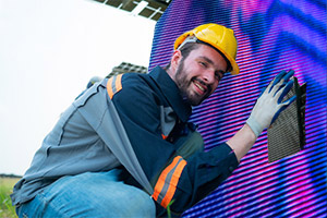 installing-energy-efficient-led-wall Technician installing an energy efficient LED wall