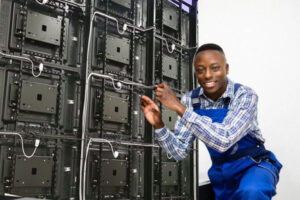 led-screen-maintenance Technician performing maintenance on LED screen to extend its life