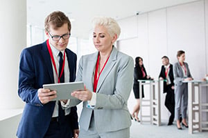 Corporate team using rented iPads in a business training